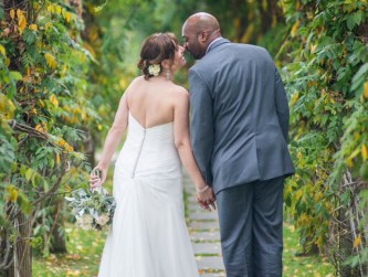 Bride and groom walking to the Barn, under the breezeway, Kaitlyn Ferris photo